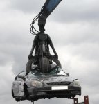 Car-on-scrap-yard-crane.jpg