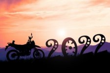 silhouette-motocross-adventure-traveler-with-a-motorcycle-happy-new-year-2022-400-265035049.jpg